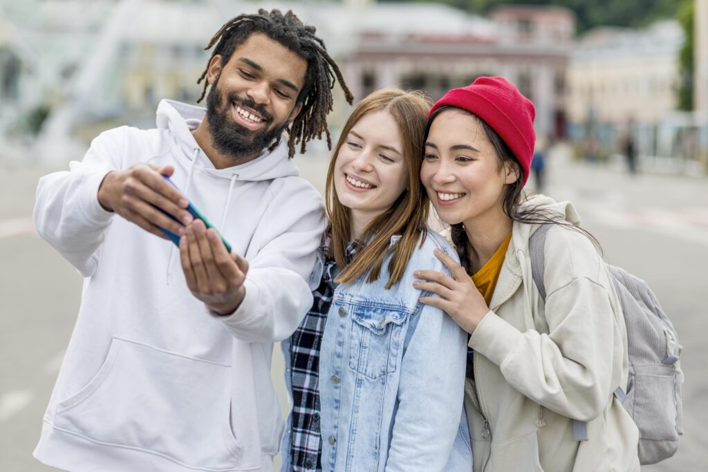 three friends taking selfie